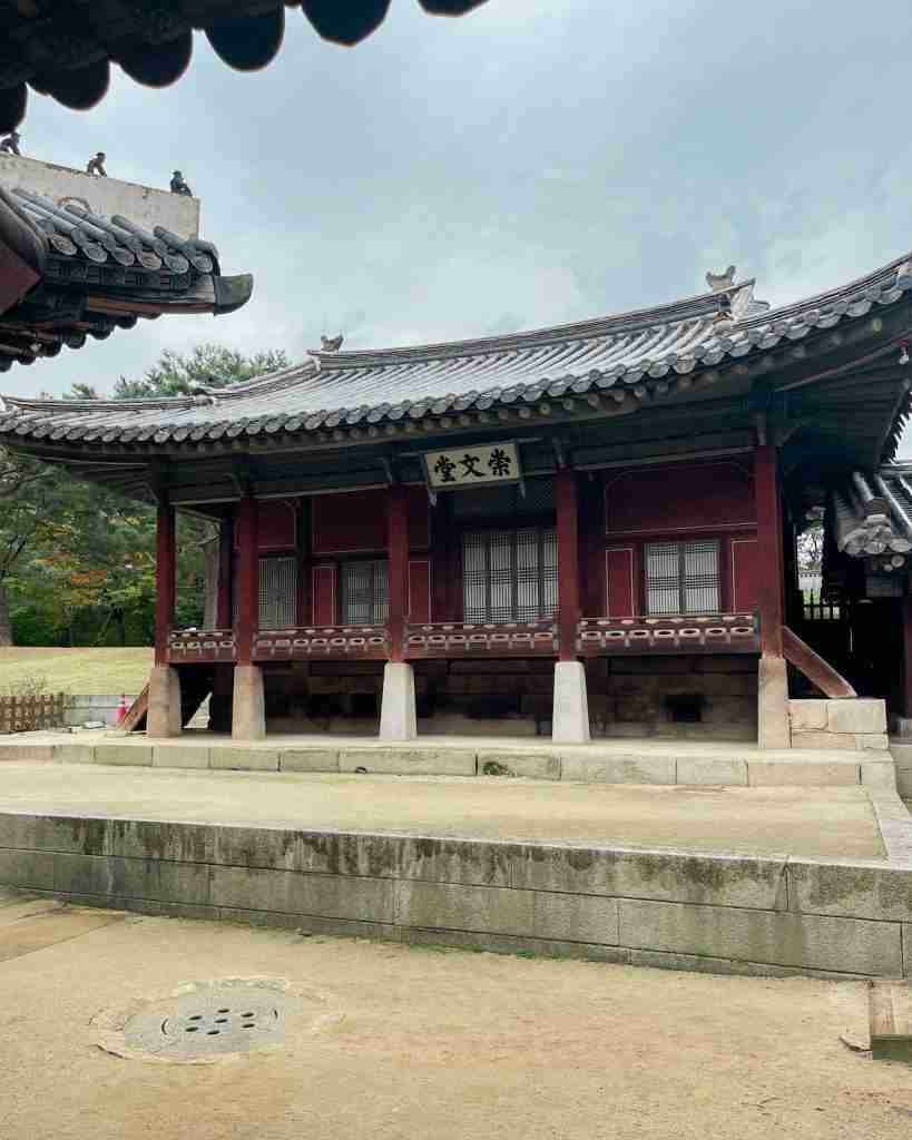 Sungmundang Hall, painted in the traditional red color characteristic of Joseon palaces.