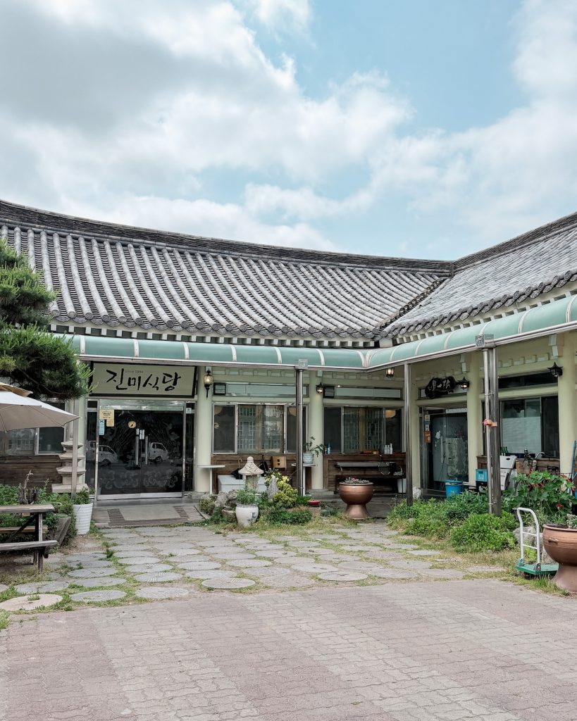Traditional hanok style building housing Jinmi Sikdang restaurant in Gyeongju, where the author gets dropped off after the hike.