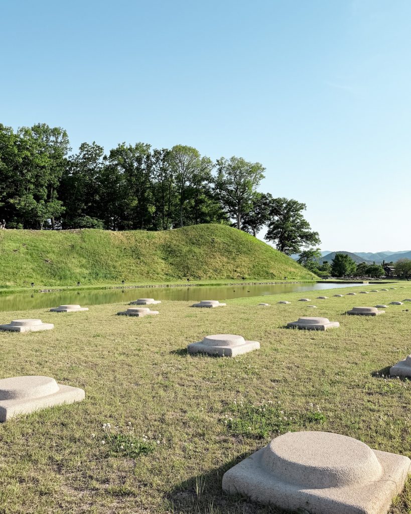 Excavated stone foundations of an ancient Silla government building preserved within the Wolseong Palace archaeological site. The ruins reveal part of the former administrative center of the Silla Kingdom.