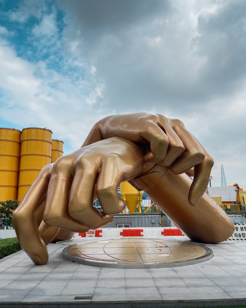 Giant bronze hands crossed in the signature Gangnam Style dance pose outside the back entrance of COEX Mall. Petra and her guide finished their four-hour Gangnam tour at this landmark.